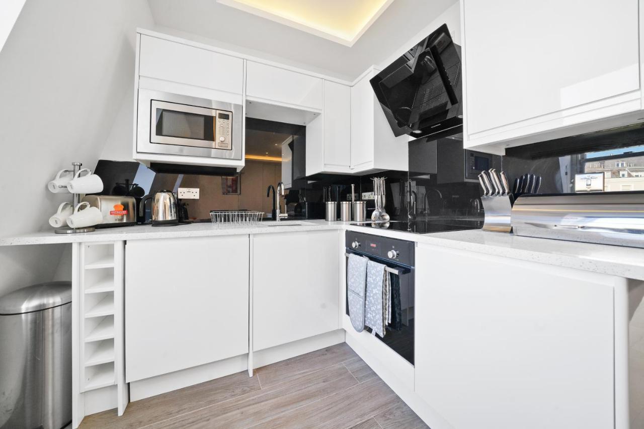 City Prime Apartments Londra Exterior foto A modern kitchen