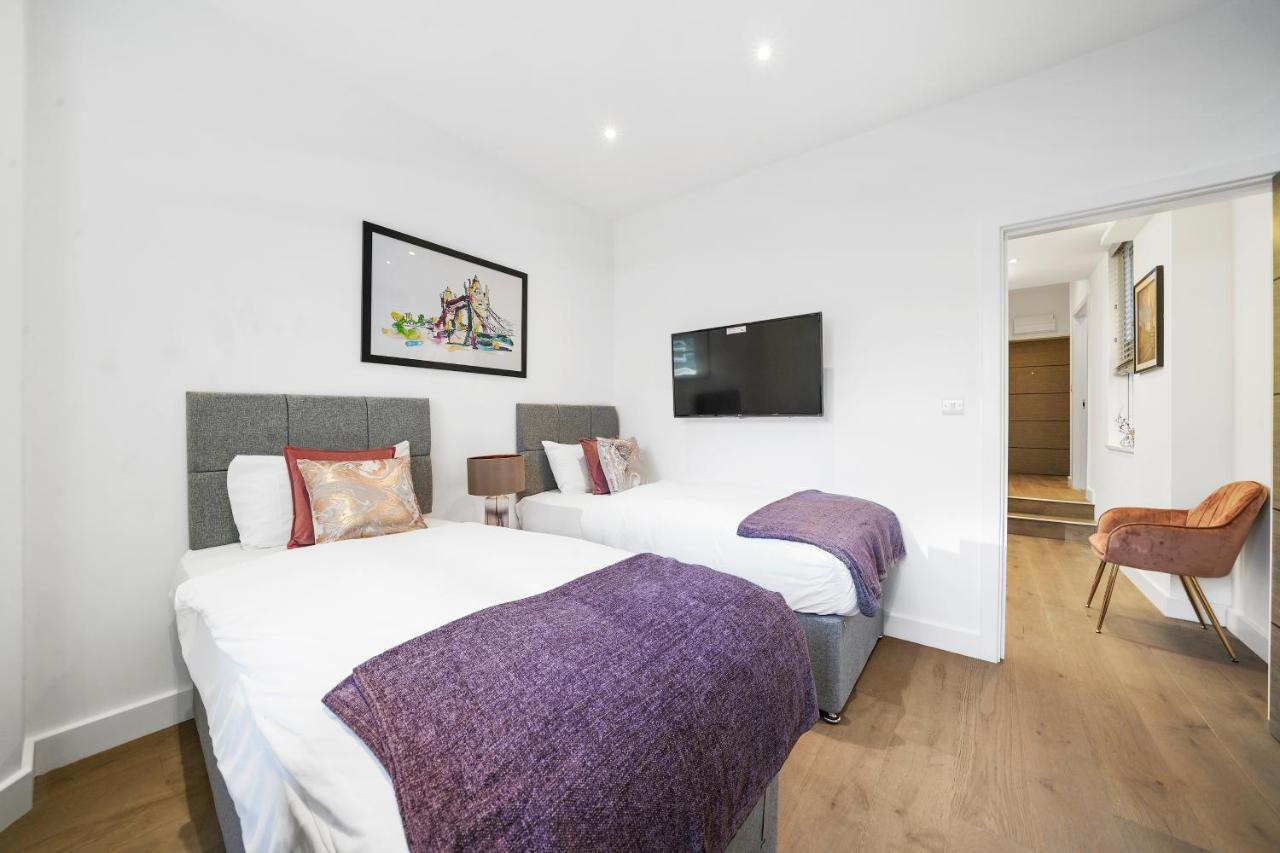 City Prime Apartments Londra Exterior foto A typical bedroom at the hotel